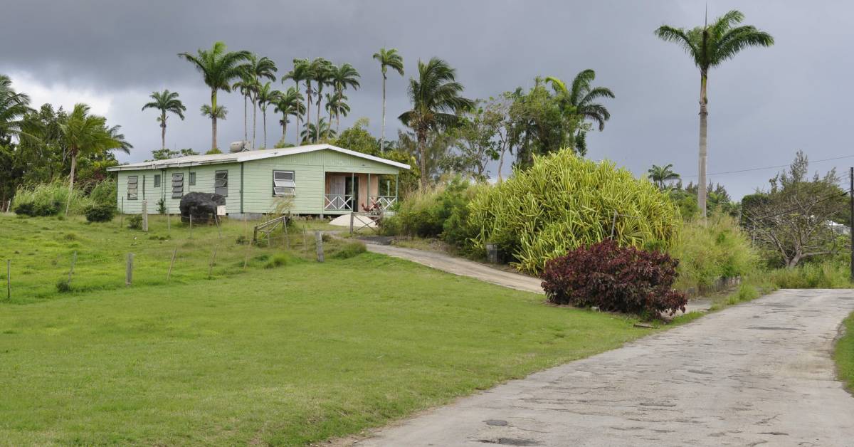 blog_All-About-Finding-the-Neighborhood-for-You-in-Barbados_Terraluxury-341229-house-bushes-clouds-blogbanner1
